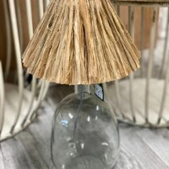 The Grey Works Lighting Hue Glass Lamp Base With A Raffia Pleat Shade